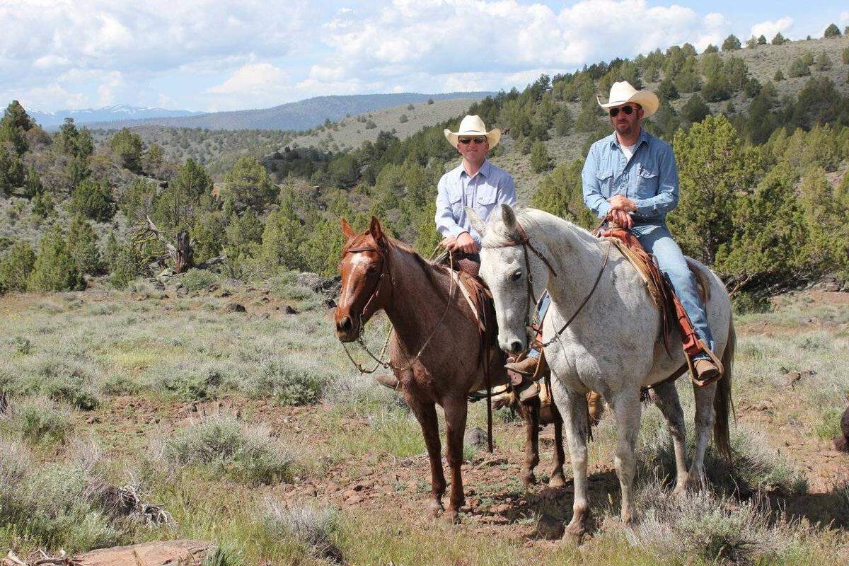 Wyatt Hanson, right, rides the family horse, Smoke, at Willow Creek Ranch in Lassen County in this undated photo. His brother, Brad Hanson, left, rides Reba. Smoke was killed by wolves on New Year’s Day 2026.