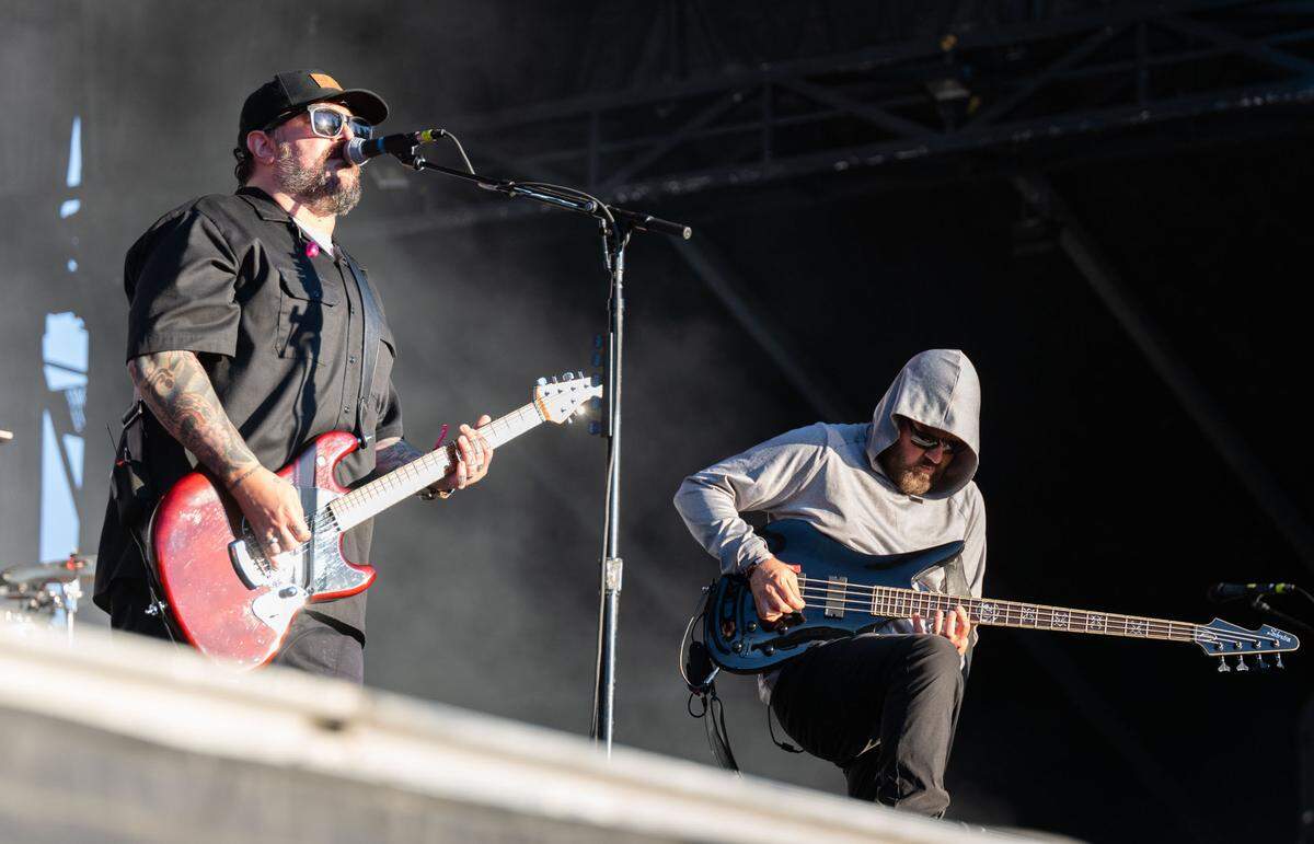 Seether lead vocalist Shaun Morgan and bassist Dale Steward perform into the glare of the sun at the Aftershock festival in Sacramento’s Discovery Park on Sunday.