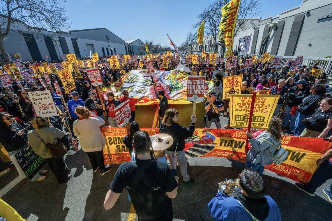 Hundreds of striking teachers and supporters coalesce at the Twin Rivers Unified district office at McClellan Park on Thursday, the strike's first day.