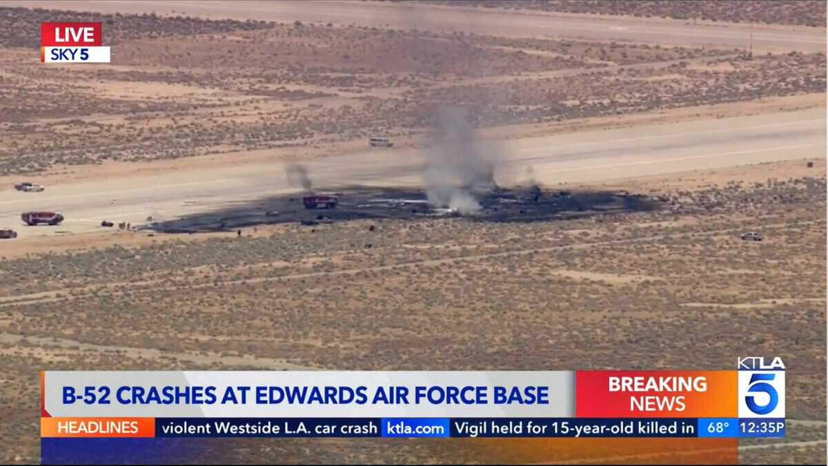 Emergency responders tend to a plane crash Monday, June 15, 2026, at Edwards Air Force Base near Lancaster, Calif., as seen from a helicopter flown by Los Angeles TV station KTLA.