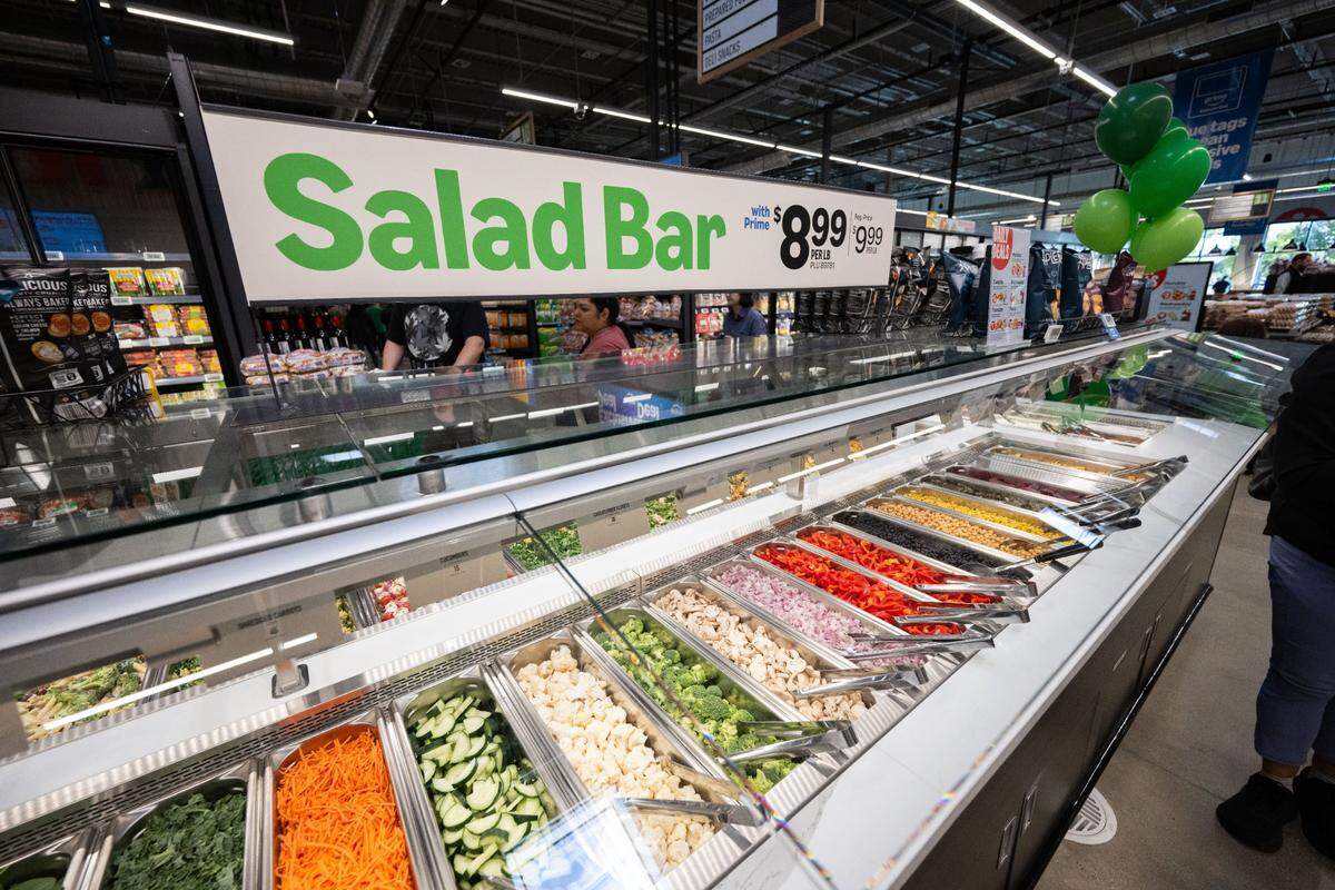 A salad bar at Amazon Fresh in Roseville offers customers prepared food sold by the pound.