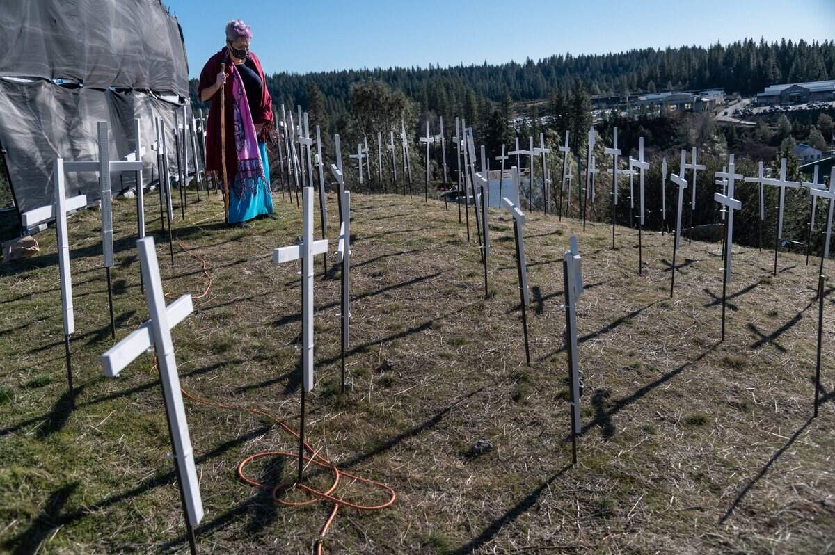 Iola Gold, from Congregation B’nai Harim at the Nevada County Jewish Community Center, looks over crosses on Tuesday, Jan. 19, 2021, after speaking at a memorial to honor the 73 lives lost to COVID-19 in Nevada County.