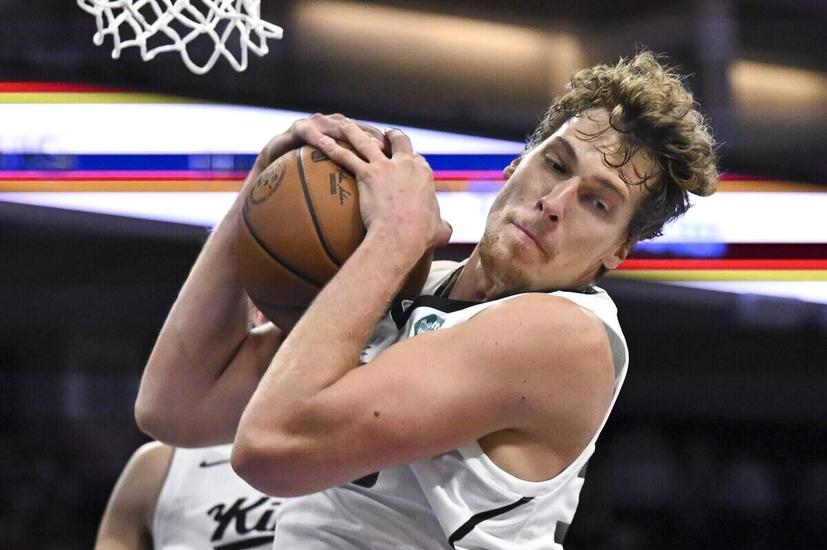 Sacramento Kings Viktor Lakhin (30) snags a rebound during a game against the Golden State Warriors in the California Classic tournament on Sunday, July 5, 2026.
