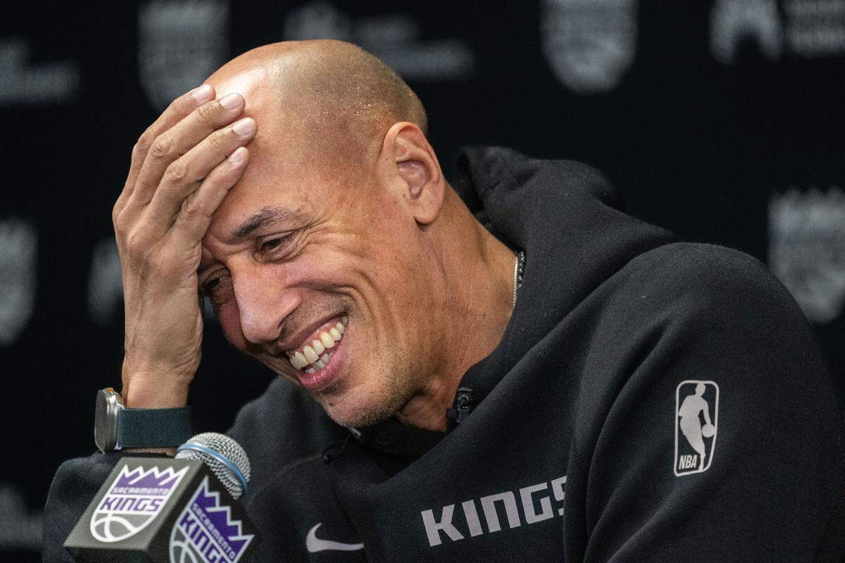 Sacramento Kings interim head coach Doug Christie reacts after being reminded he might be fined for using a curse word during a pregame press conference before his first home game at Golden 1 Center on Monday, Dec. 30, 2024.