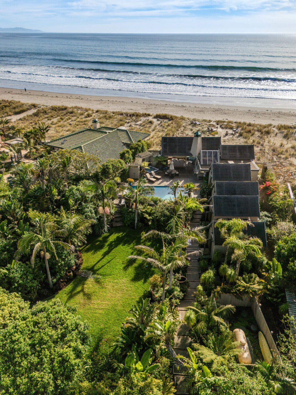 The Stinson Beach home on the market for $16 million “opens to the gardens, the pool and the beach beyond.”