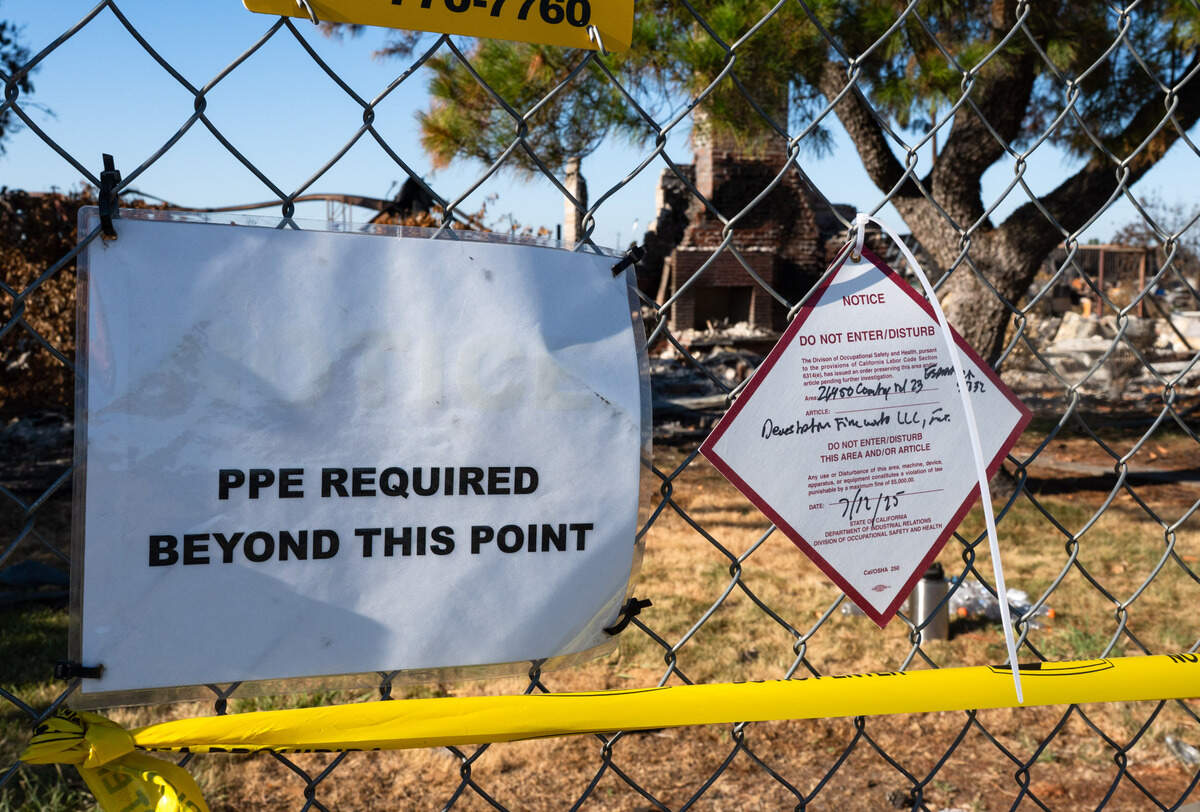 Signs and caution tape forbid entry at the Esparto fireworks explosion site on Friday, July 18, 2025, the first day the evacuation order and area road closures were lifted.