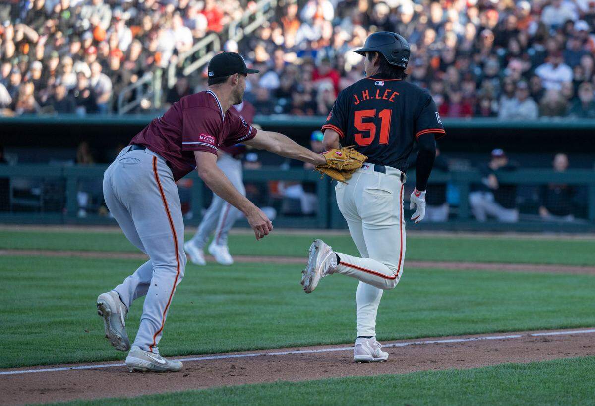 Sacramento River Cats’ Mason Black tags out San Francisco Giants’ Jung-Hoo Lee who got caught in a pickle during an exhibition game Sunday.