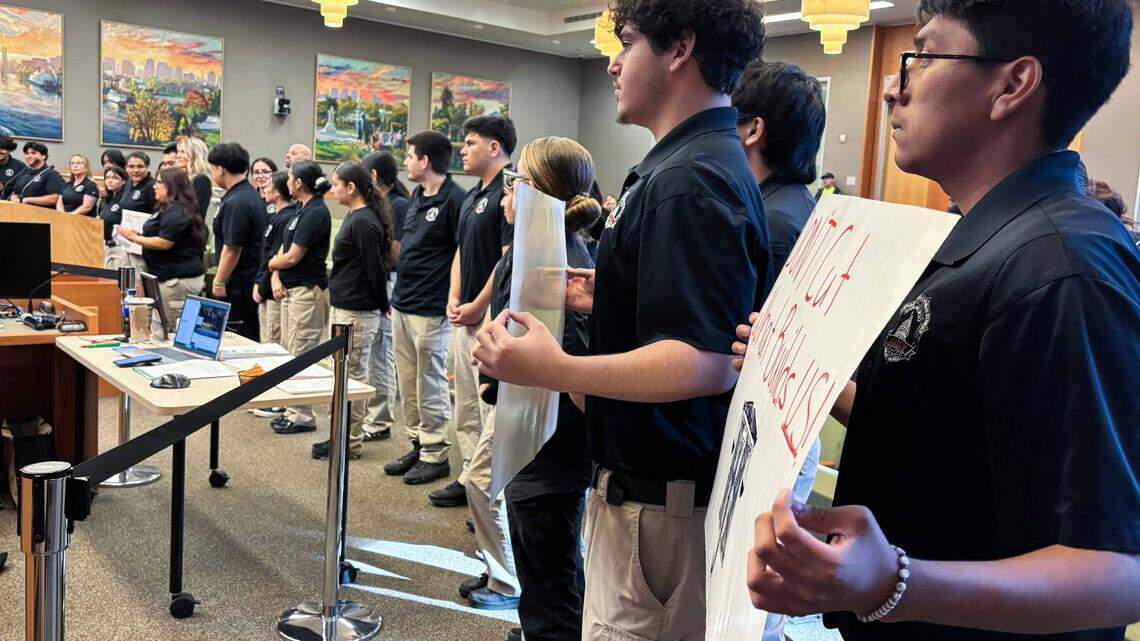 High school students involved in Sacramento Police Department Magnet Academy programs show their support for the programs, potential targets for budget cuts, at a City Council meeting on Tuesday.