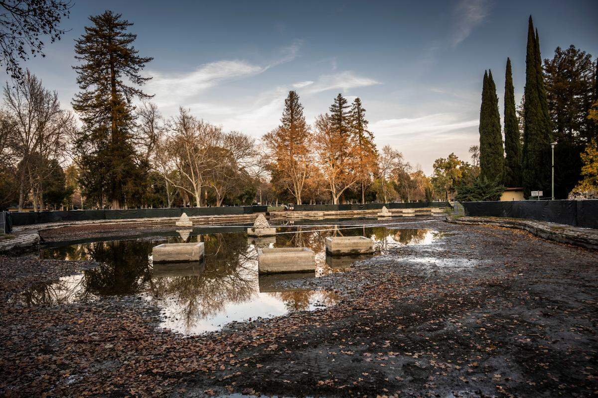 The William Land Park duck and lily pond in Sacramento is photographed by drone inside the fenceline in December 2022. The pond was being drained in an effort to protect Sacramento Zoo animals from avian flu. The city is also doing some necessary maintenance and repairs.