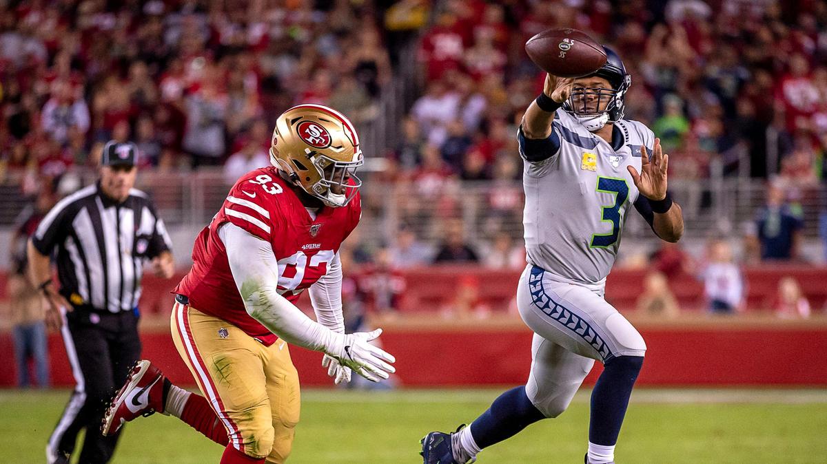 San Francisco 49ers’ D.J. Jones (93) pressures Seattle Seahawks quarterback Russell Wilson (3) in the first quarter during a game at Levi’s Stadium on Monday, Nov. 11, 2019 in Santa Clara.