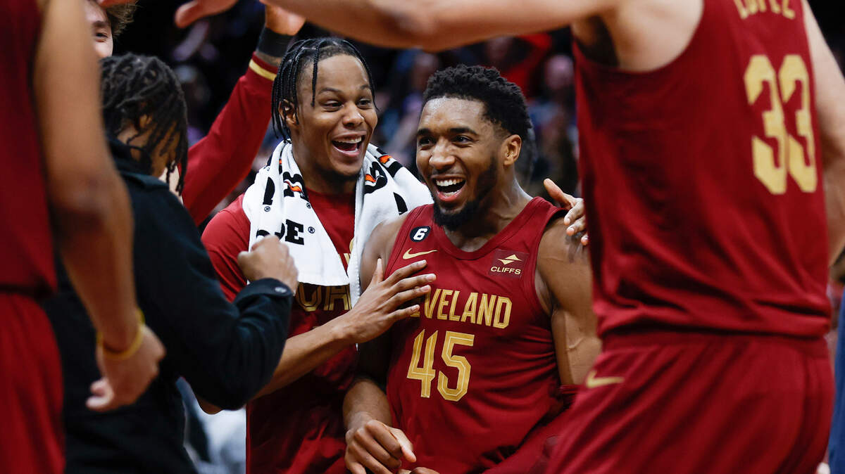 Cleveland Cavaliers guard Donovan Mitchell (45) celebrates with teammates after making a basket to tie an NBA basketball game during the second half against the Chicago Bulls, Monday, Jan. 2, 2023, in Cleveland. (AP Photo/Ron Schwane)
