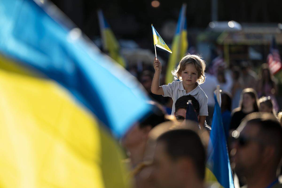 Ukrainian Americans wave Ukrainian flags during a Ukrainian Independence Day celebration at the California Capitol in Sacramento on Sunday.