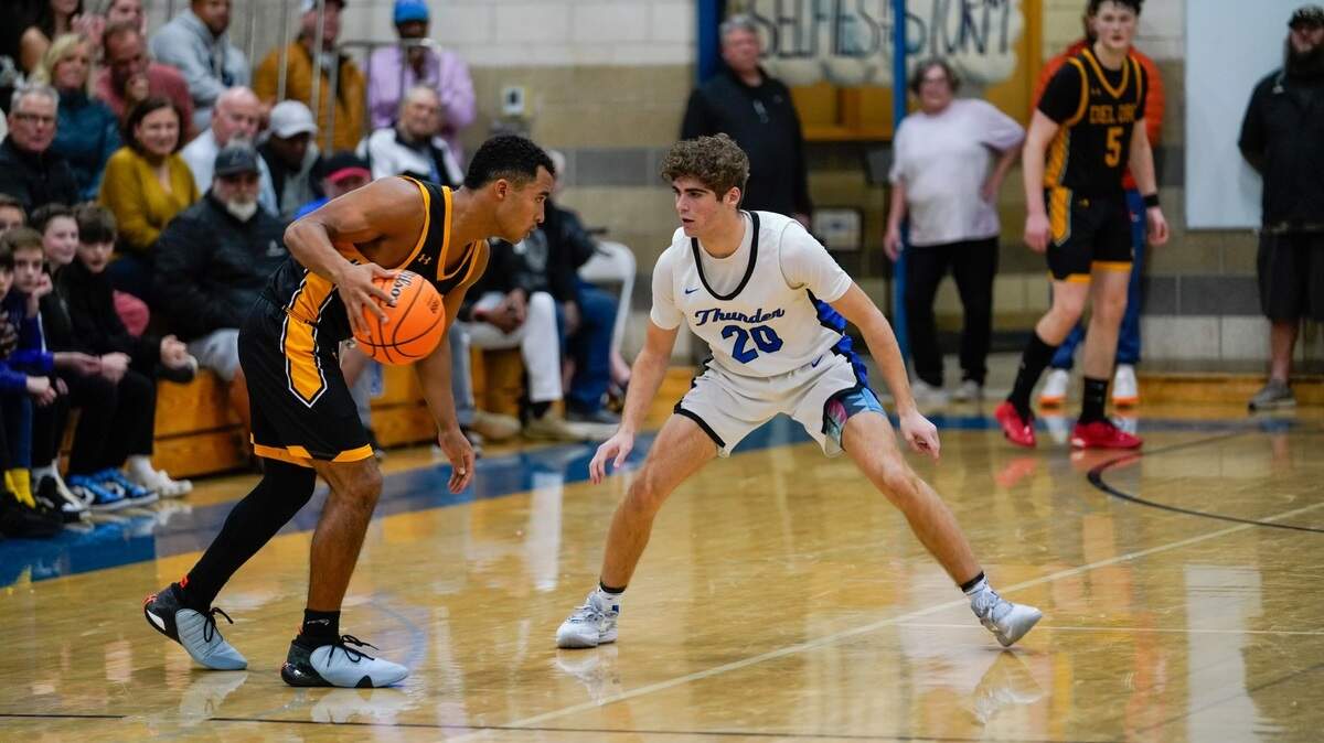 Rocklin’s Reeve Slone, right, guards Del Oro’s Caden Pinnick in a showdown of Bee All-Metro quarterback stars. Slone hit the game-winning 3-pointer to help Rocklin remain unbeaten with an overtime win over Del Oro.