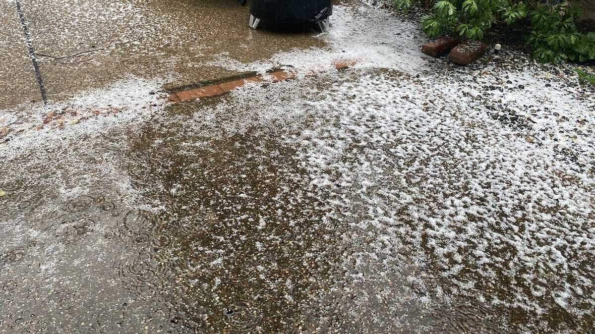 Hail was seen sticking to the ground in the Land Park section of Sacramento, Calif., on Friday, Jan. 22, 2021. Rain and more fell Friday as the first in a series of storms moved through California, marking a major change to real winter weather after weeks of scattershot precipitation that has done little to ease drought. (Ryan Lillis/The Sacramento Bee)