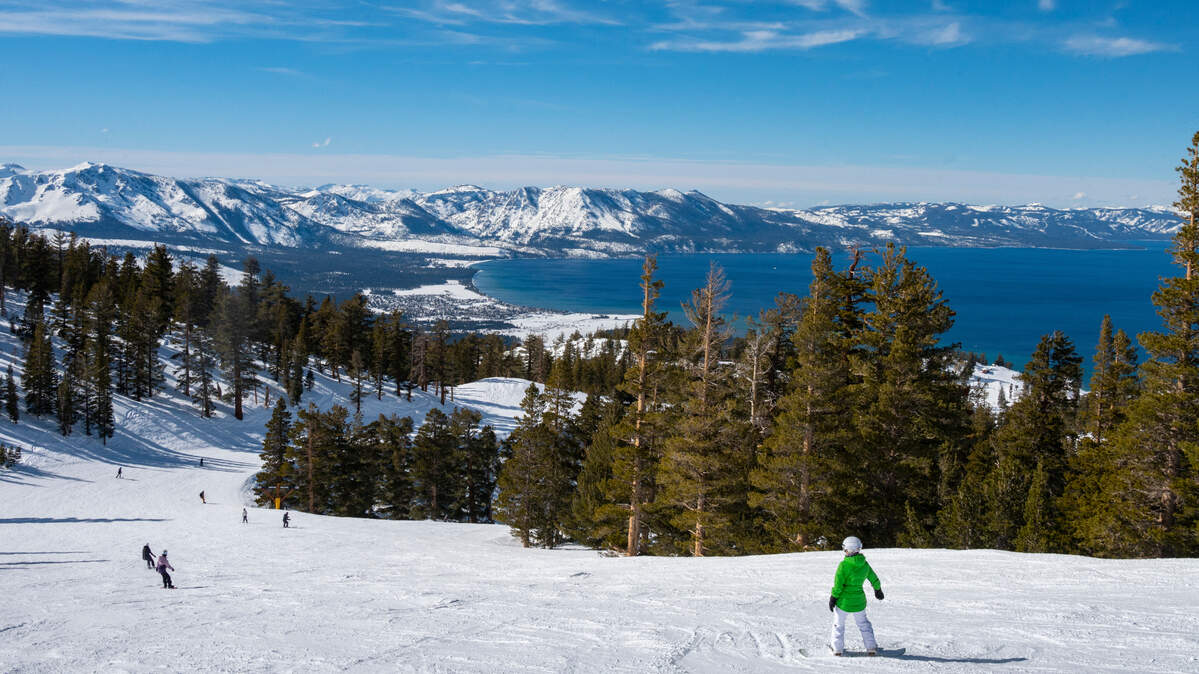 A snowboarder pauses to take in the views of Lake Tahoe from Heavenly Mountain Resort earlier this year.