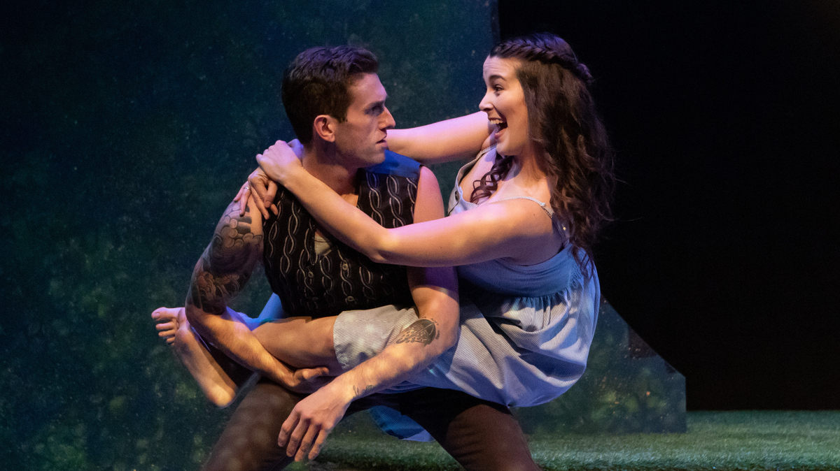 Helena (Carissa Meagher) offers a comedic gymnastic assault of Demetrius (Darek Riley) in “A Midsummer Night’s Dream.”