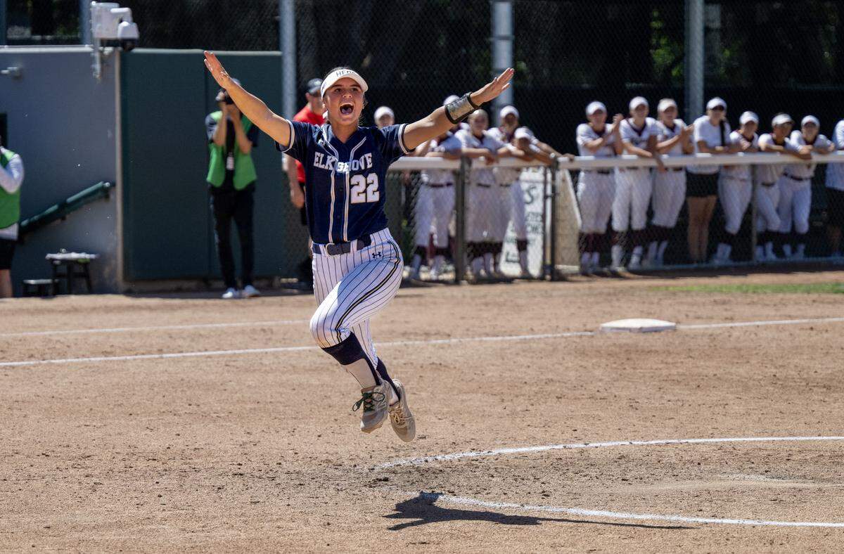 The Elk Grove Thundering Herd’s Hudson Hall (22) celebrates following the 3-2 victory over the Del Oro Golden Eagles on Saturday, May 23, 2026, in the CIF Sac-Joaquin Section Division II softball championship at Sacramento State.