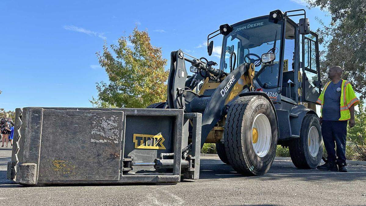 The Claw, a front-loading tractor fitted with an articulating bucket for picking up loose debris, is demonstrated to the public at North Natomas Regional Park on Saturday, Oct. 21, 2023. The implement, operated by the city of Sacramento’s Public Works Department, is deployed during the fall and winter months to pick up leaf piles across the city.