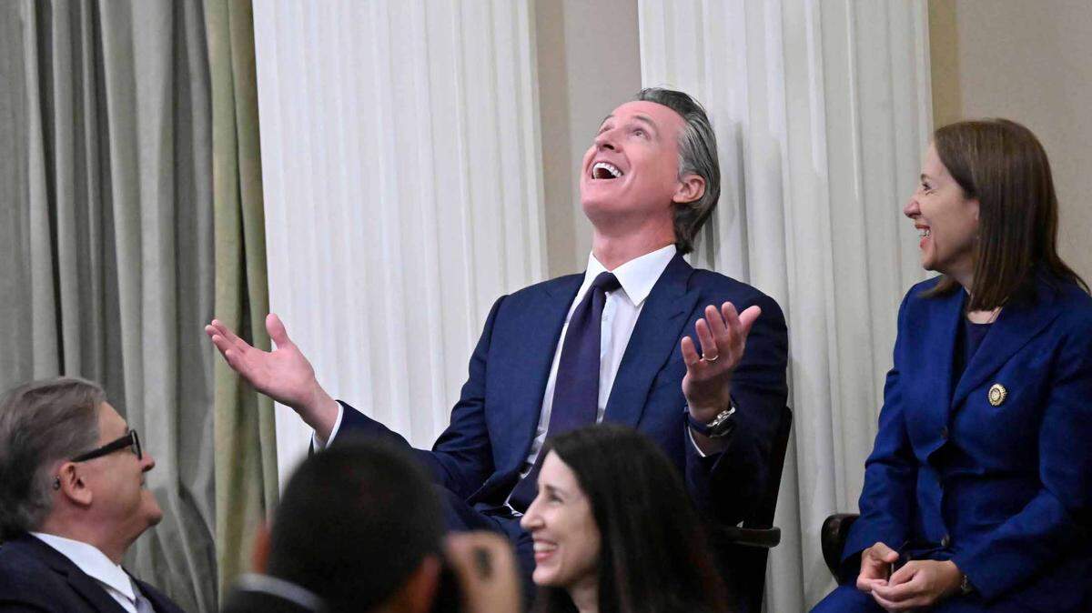 Gov. Gavin Newsom makes light of a formality during the reading of the calendar, prior the the start of the swearing-in ceremony for new California Assembly Speaker Robert Rivas in Sacramento on Friday, June 30, 2023.