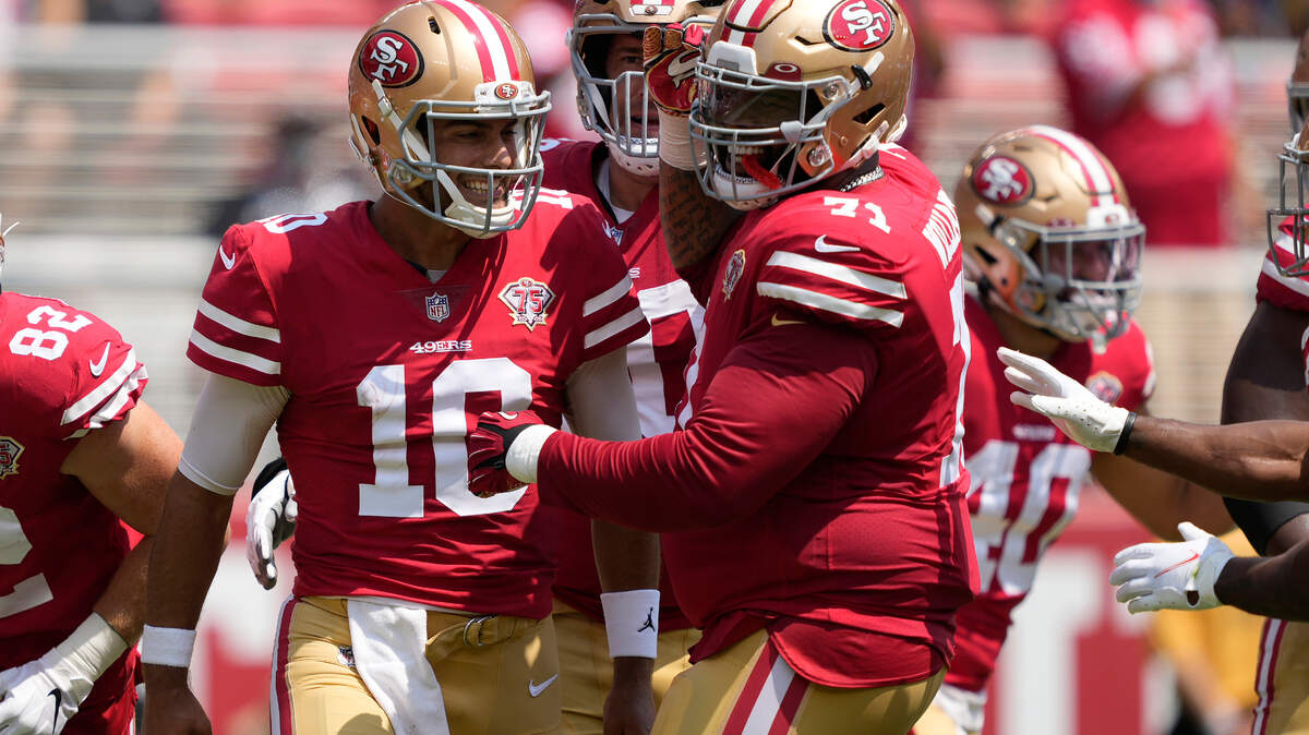 San Francisco quarterback Jimmy Garoppolo celebrates with offensive tackle Trent Williams after scoring on a run play Sunday against the Las Vegas Raiders.
