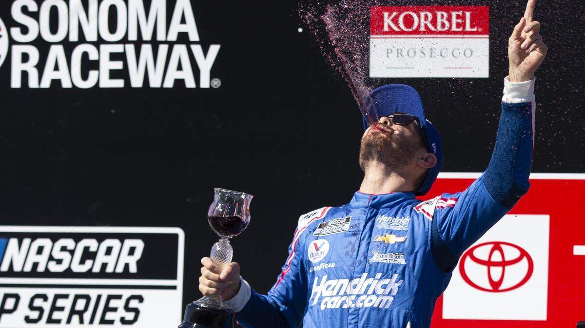Kyle Larson celebrates his victory in a NASCAR Cup Series auto race, Sunday, June 6, 2021, at Sonoma Raceway in Sonoma, Calif.