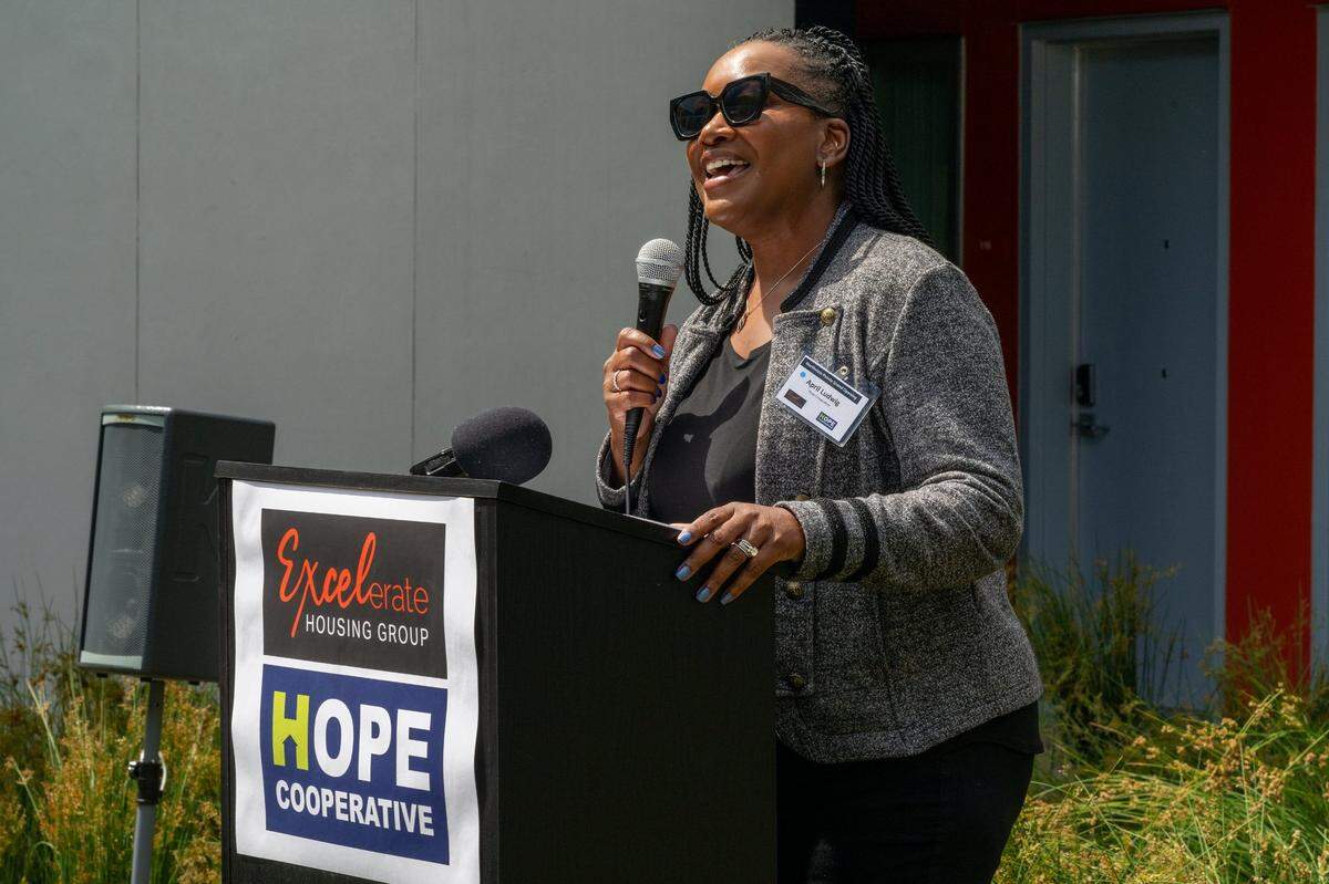 Hope Cooperative CEO April Ludwig speaks at the grand opening of Northview Pointe, a 67-unit permanent supportive housing development for people experiencing homelessness in North Sacramento, on Wednesday. The complex was developed by Excelerate Housing Group, a woman-owned affordable developer, and Hope Cooperative, a woman-led Sacramento-based housing, behavioral health and homeless service provider.