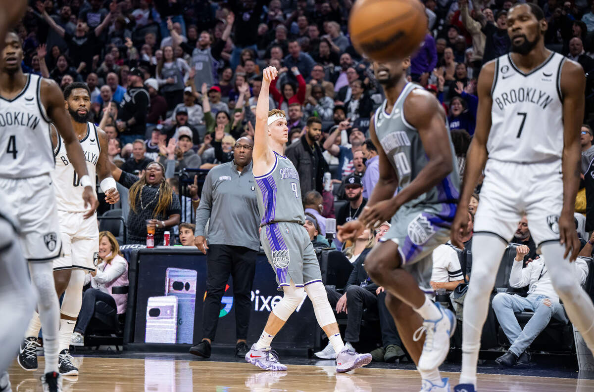 Sacramento Kings guard/forward Kevin Huerter (9) follows through on sinking a three point basket against the Brooklyn Nets as the crowd cheers during in November.