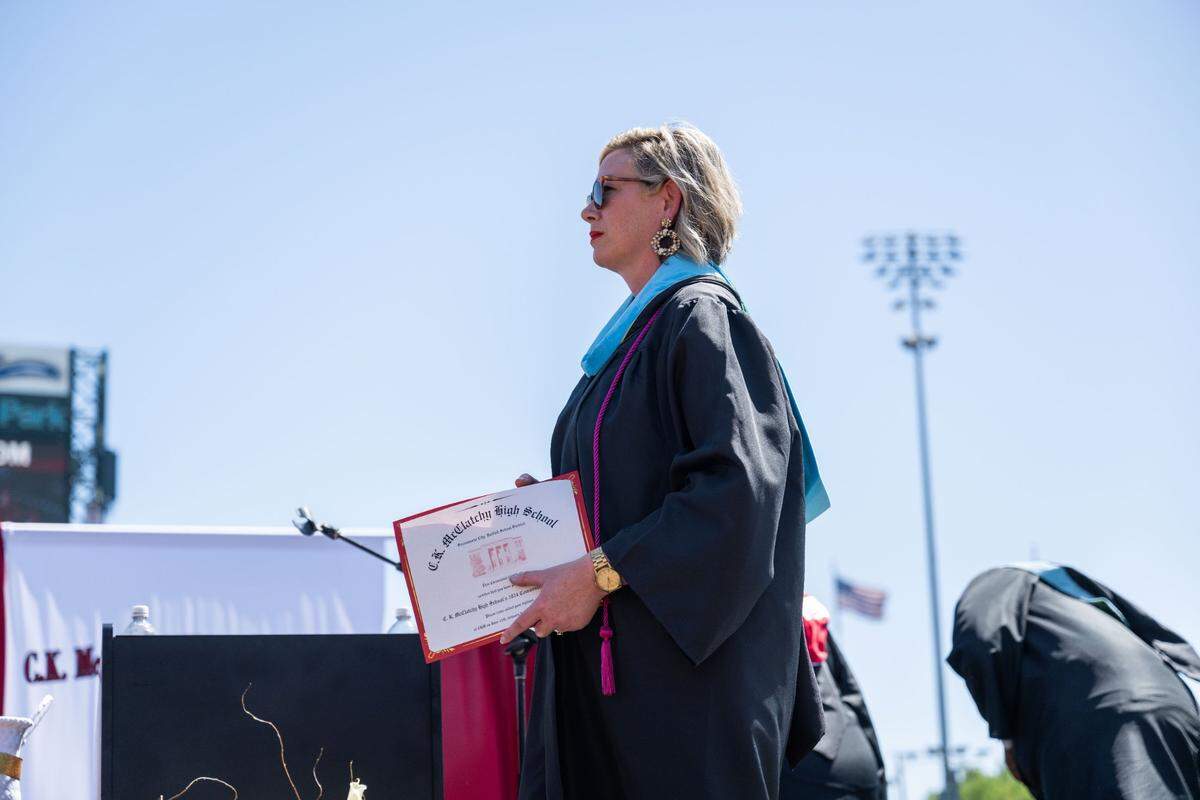 C.K. McClatchy principal Andrea Egan waits for the next graduate during the commencement ceremony Tuesday.
