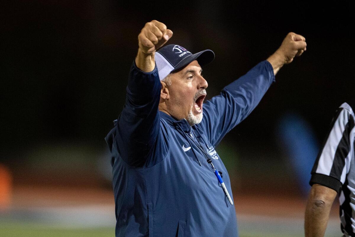 Oakmont Vikings head coach Jake Messina celebrates following a victory over the Marysville Indians in October. Messina is one of several Sacramento-area coaches resigning to spend more time with family.