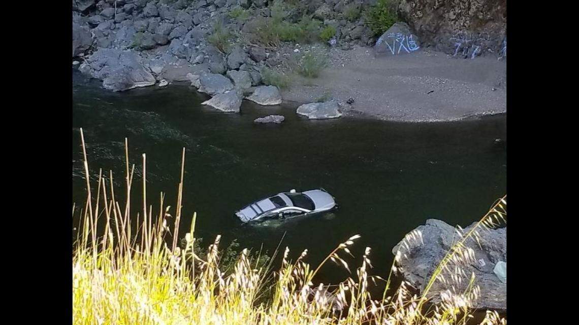 Two women survived a 300-foot plunge Tuesday from Highway 101 into the Russian River when their SUV landed on a rock rather than sinking into the river, firefighters reported.