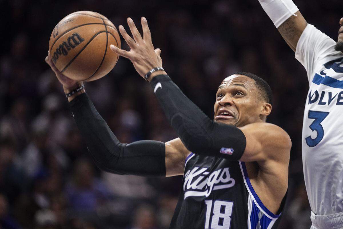 Sacramento Kings guard Russell Westbrook drives to the basket against Minnesota Timberwolves forward Jaden McDaniels during an NBA game at Golden 1 Center on Monday, Nov. 24, 2025. Westbrook on Wednesday in Houston surpassed Tim Duncan for 17th on the NBA’s all-time career scoring list.