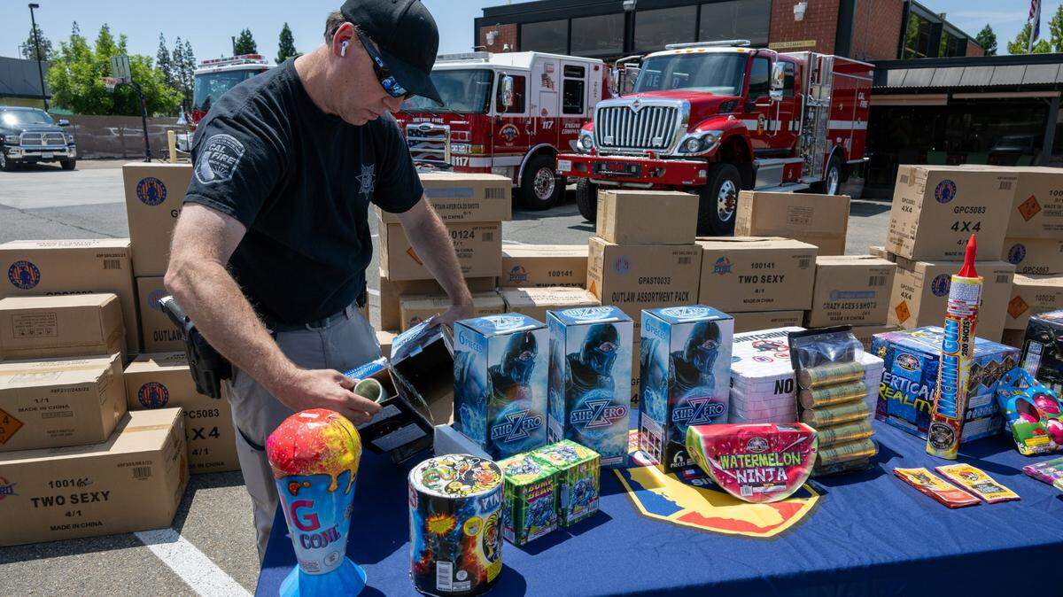 Cal Fire Supervisor for Arson and Bomb Bryan Gouge opens a box of illegal aerial motars as Cal Fire, along with local firefighting agencies, warn about the dangers of illegal fireworks on Tuesday, June 27, 2023, in Sacramento. The only fireworks that can be sold in California are “Safe and Sane” fireworks.