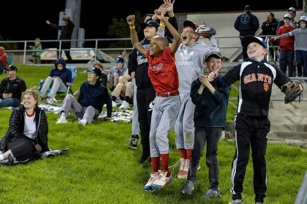 Children are excited to be on the Jumbotron during the Moove It cam in the fifth inning at the home opener against the Sugar Land Space Cowboys on Tuesday, April 5, 2022, at Sutter Health Park in West Sacramento. The River Cats won 7-6.