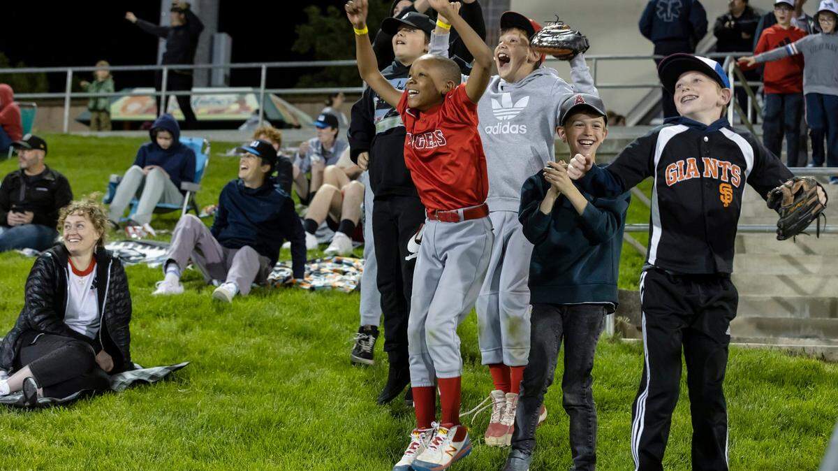 Children are excited to be on the Jumbotron during the Moove It Cam in the fifth inning at the home opener against the Sugar Land Space Cowboys on Tuesday, April 5, 2022, at Sutter Health Park in West Sacramento. The River Cats won 7-6.