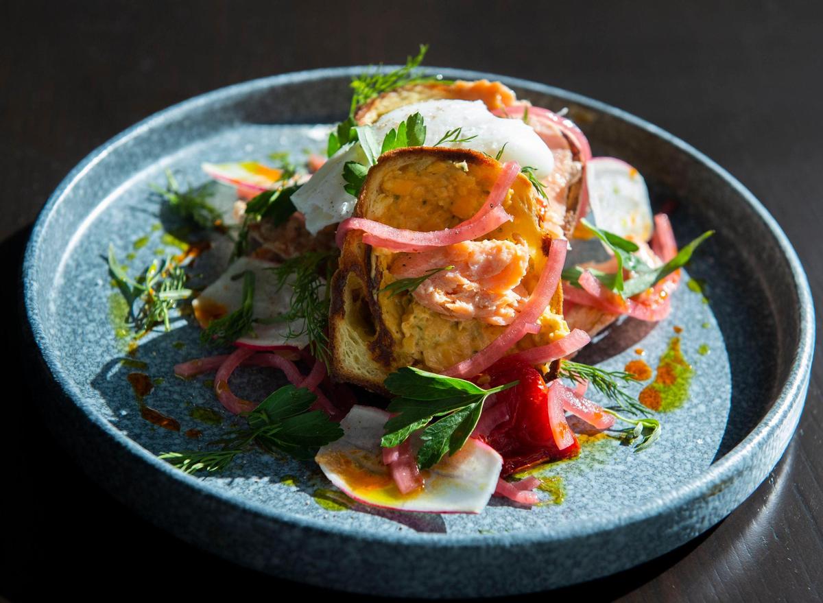 Popover “lox” made with smoked trout, preserved tomatoes, pimento cheese, pickled onions and sweet herbs is served at the new 7th Street Standard restaurant inside the Hotel Centric. Ravin Patel is the head chef.
