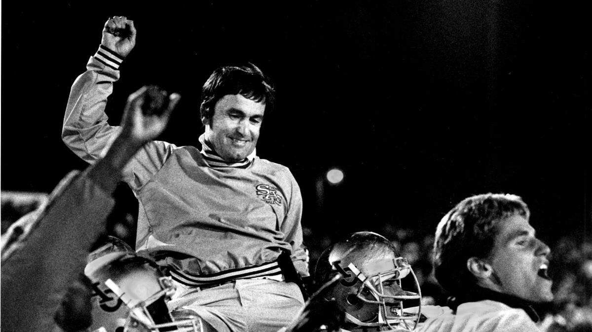 Just after after beating UC Davis 31-28, Sacramento State coach Bob Mattos is hoisted on shoulders of players and carried onto the playing field. The Hornets ended an 18-game losing streak to UC Davis. Mattos passed away Sunday, March 14, at age 68. Scanned in file photo taken September 24, 1988 by Dick Schmidt / The Sacramento Bee