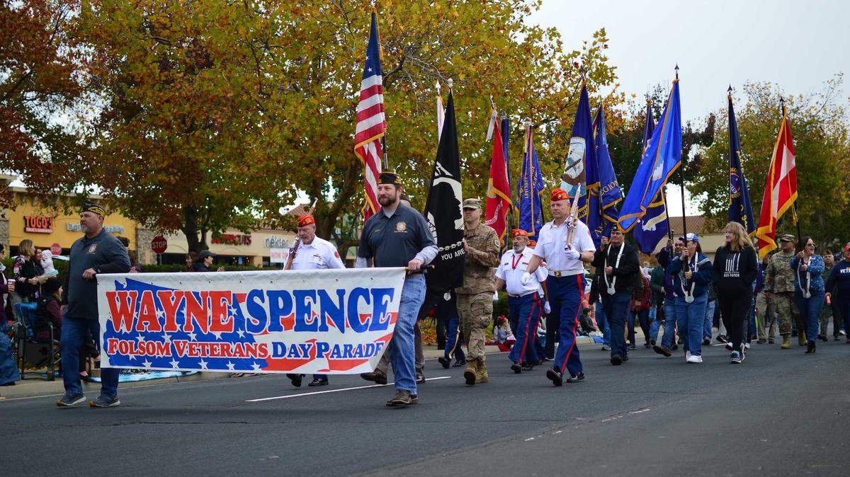 The Wayne Spence Folsom Veterans Day parade, named after Jess Wayne Spence in 2009, marches west on East Bidwell Street on Nov. 11, 2021. The city assured detours around the parade this year will be marked, and drivers are encouraged to take Riley and School streets as alternate routes.