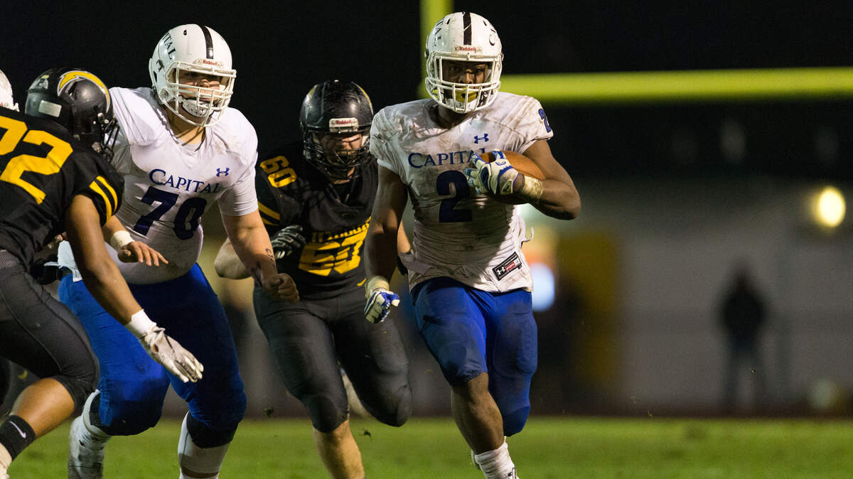 Capital Christian’s D’Marcus Ross (2) breaks off a long run during the CIF NorCal Division 3-A championship game Saturday night, Dec. 8, 2018, at Wilcox High School in Santa Clara. The Cougars lost 34-30.