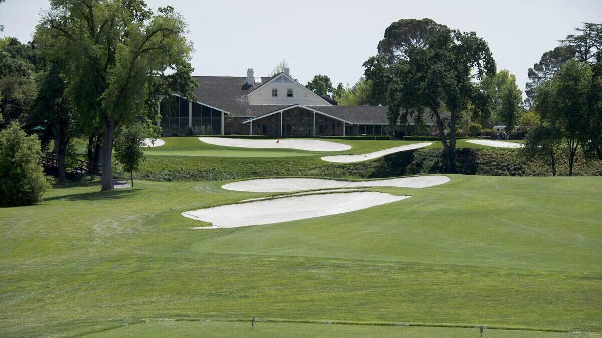 FILE -- The view looking down the 18th green towards the clubhouse at the Del Paso Country Club Thursday April 9, 2015 in Sacramento, Calif. A family business forum will be held at the country club Tuesday, April 17, 2018.