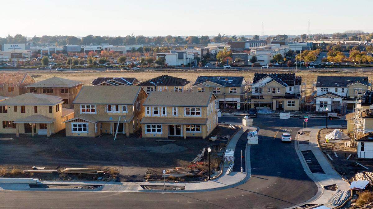 New homes rise in the Delta Shores development near the shopping center in south Sacramento on Dec. 12, 2023.