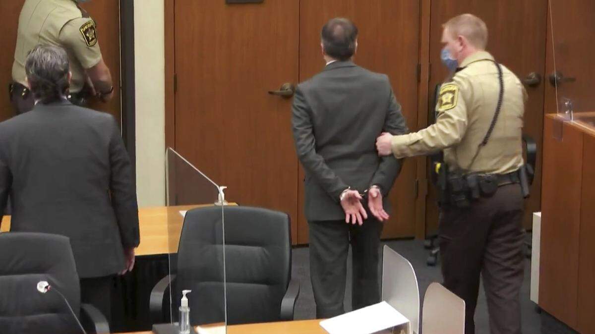 In this image from video, former Minneapolis police Officer Derek Chauvin, center, is taken into custody as his attorney, Eric Nelson, left, looks on, after the verdicts were read at Chauvin’s trial for the 2020 death of George Floyd, Tuesday, April 20, 2021, at the Hennepin County Courthouse in Minneapolis, Minn. (Court TV via AP, Pool)