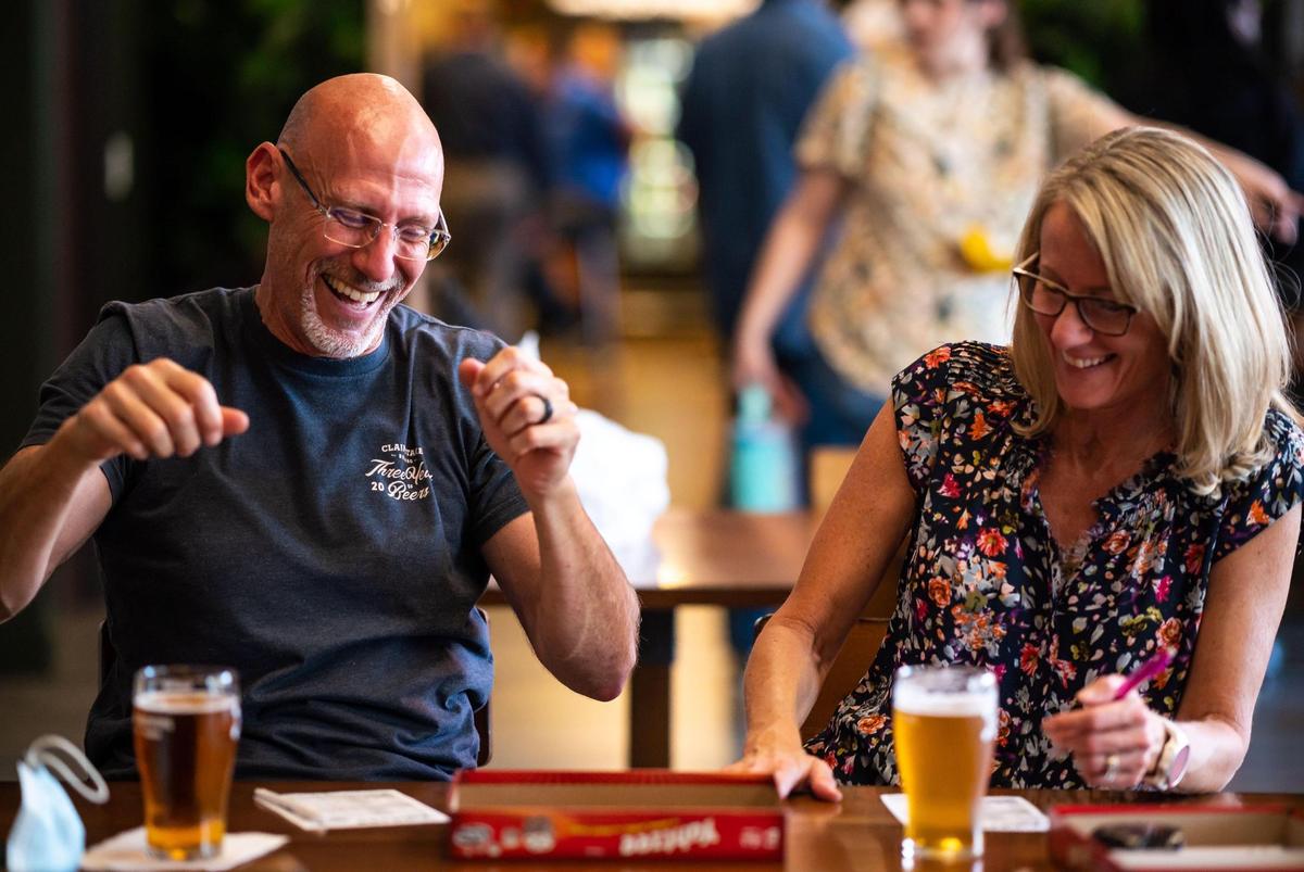 Greg Fabun celebrates a Yahtzee while playing with his wife, Paulina Benner, both of Rancho Cordova, at LogOff Brewing on Friday, Oct. 1, 2021, in Rancho Cordova. “They do a lot of good beers, so have lots of favorites,” Fabun said, citing their wide selection. “They do a lot of things well.”