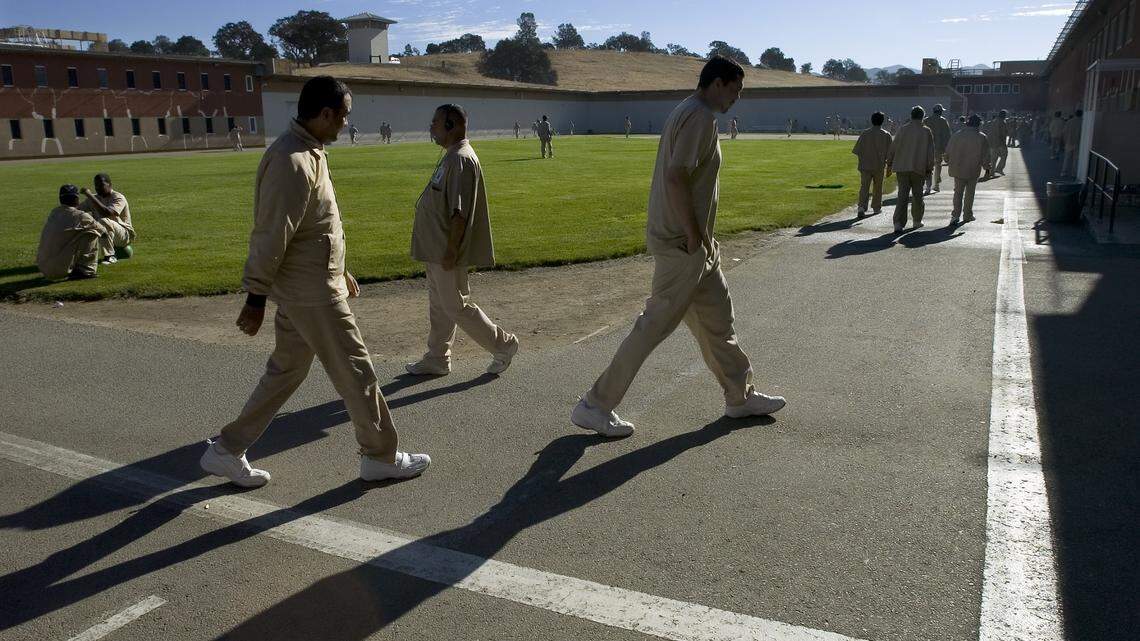 Patients walk the yard during their exercise time at Atascadero State Hospital in Astascadero, California. September 23, 2005. Sacramento Bee Photo / Paul Kitagaki Jr.