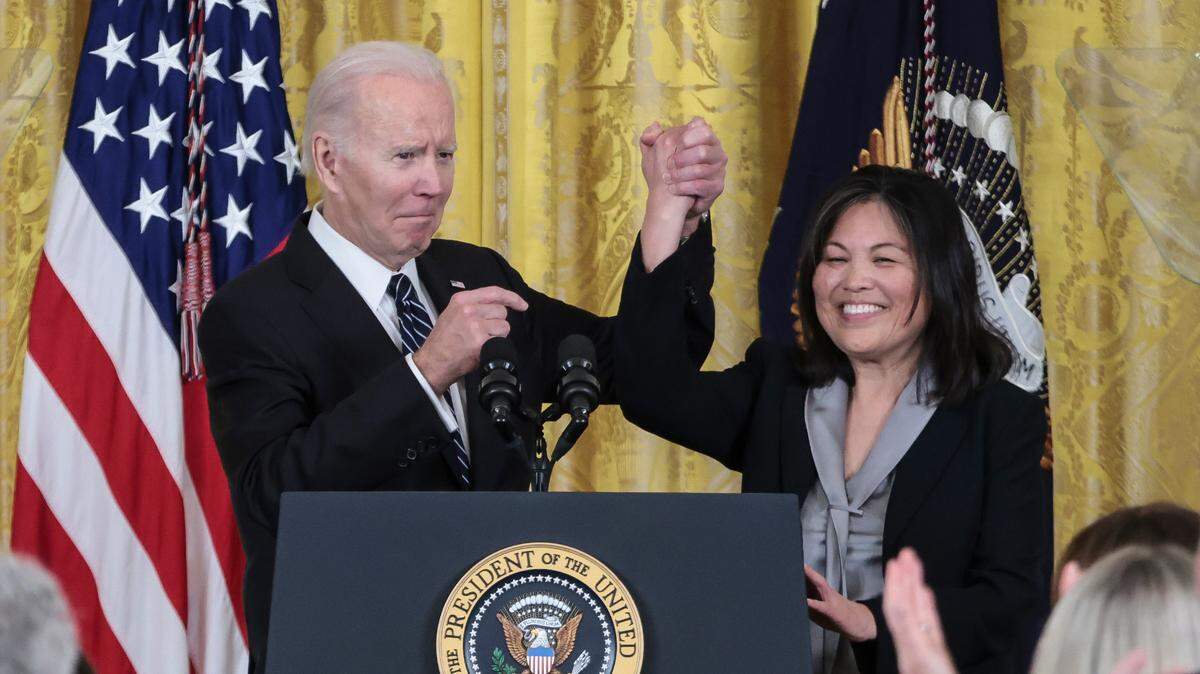 President Joe Biden holds hands with Julie Su as he nominates her to serve as US Secretary of Labor, in the East room of the White House in Washington, DC, on March 1.