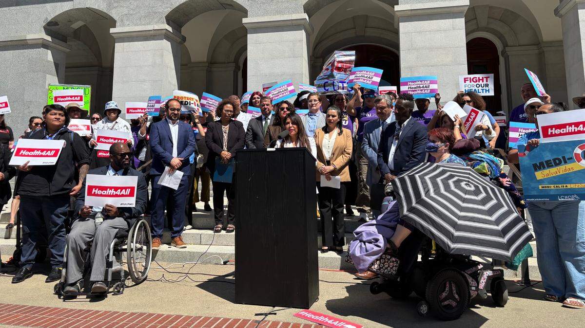 Assemblymember Liz Ortega, D-San Leandro, speaks outside the Capitol on Tuesday, May 20 with fellow legislators to oppose Gov. Gavin Newsom’s proposed cuts to Medi-Cal.