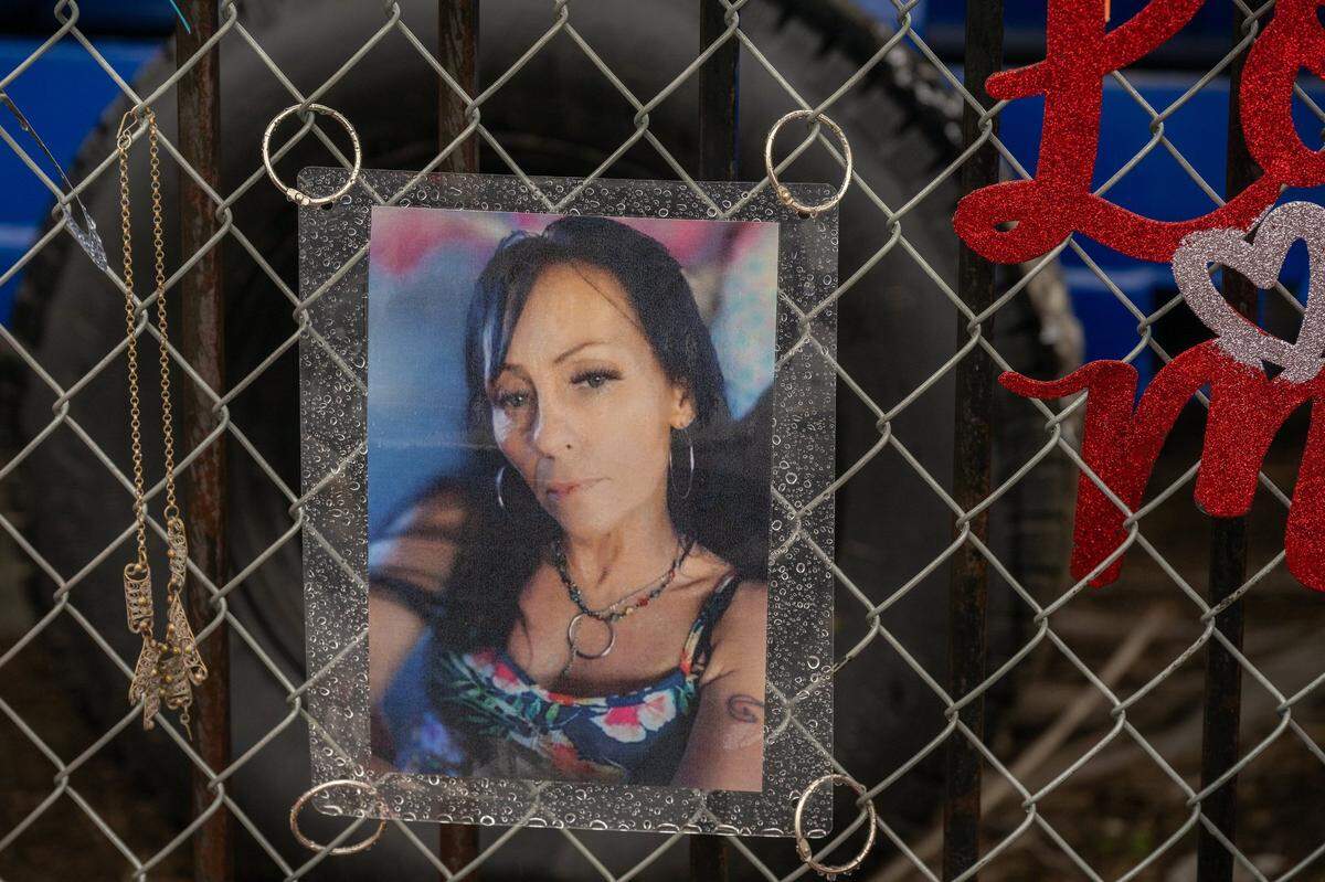A photograph of Wendy Connell, who lived at the Rosevllle Road shelter for the homeless in Sacramento, hangs earlier this month on a memorial for her at the intersection of Roseville Road and Longview Drive, where she was fatally hit by a truck while cycling to a dentist appointment.