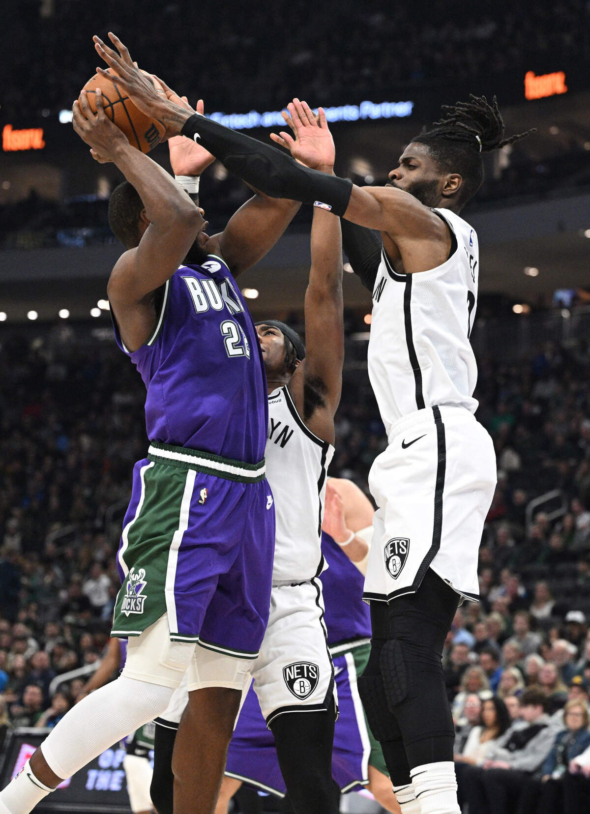 Milwaukee Bucks forward Khris Middleton (22) drives to the basket against Brooklyn Nets center Nerlens Noel (0) in the first half March at Fiserv Forum in Milwaukee, Wisconsin.