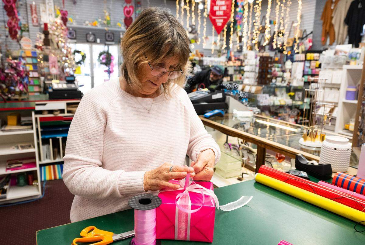 Manager Wendy Gray wraps a gift at Mixed Bag, a beloved midtown Sacramento gift shop, on Thursday. Free gift wrapping services for customers are a point of pride for Gray. “When they come here they are going to get a nice wrap,” she said. “The gift is complete. It doesn’t end with just buying it.”