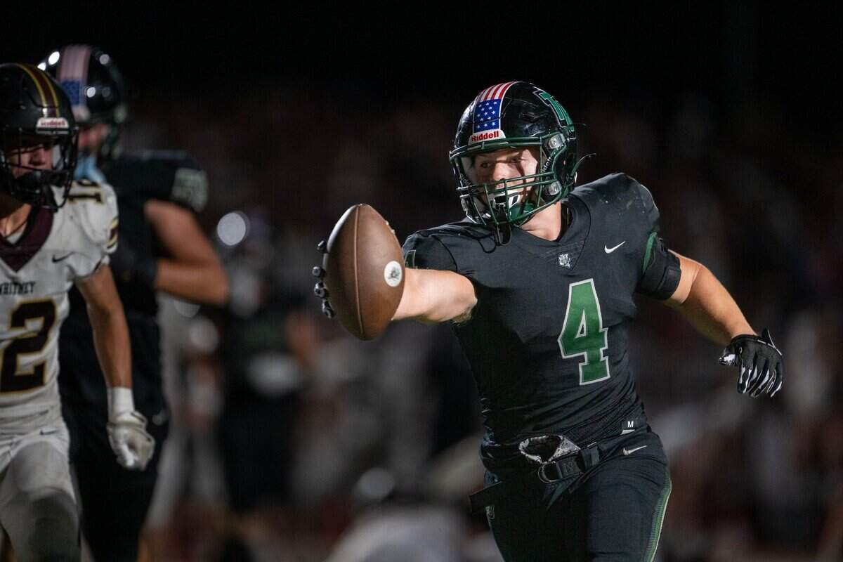 Twelve Bridges Raging Rhinos running back Chase Wyhlidko (4) scores a touchdown in the second quarter against the Whitney Wildcats on Friday, Sept. 6, 2024, at Twelve Bridges High School.