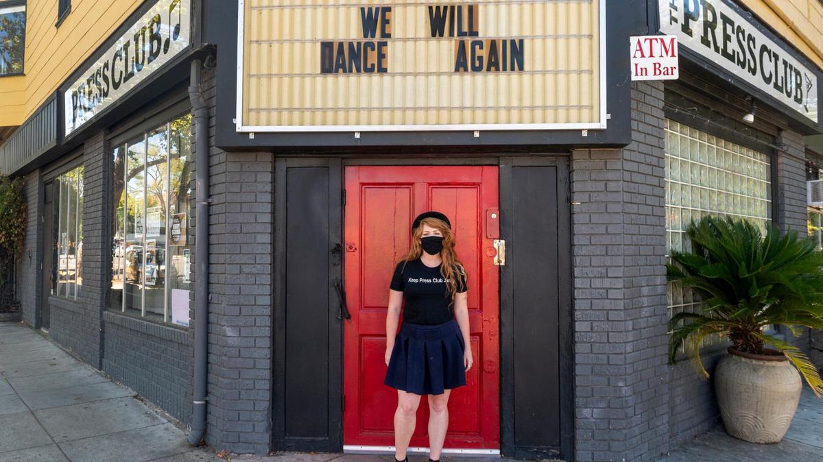 Mikhala Taylor Lazetich, on a pandemic furlough from her bartending job at the time of this photo, stands outside of the Press Club in midtown Sacramento in 2020.